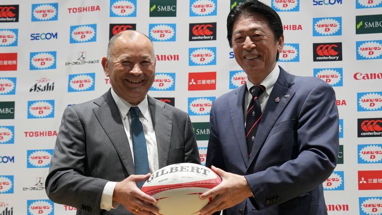 Eddie Jones of Australia, left, poses for photographers with Japan Rugby Football Union (JRFU) President Masato Tsuchida during a news conference Thursday, Dec. 14, 2023, in Tokyo. Jones was named as new coach of the Japan national rugby team on Wednesday. (AP Photo/Eugene Hoshiko)