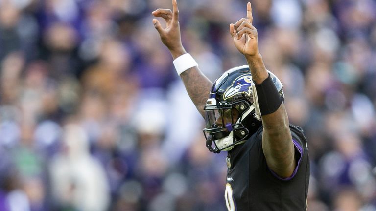 Lamar Jackson celebrates as the Baltimore Ravens beat the Miami Dolphins in Week 17
